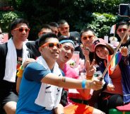 A group poses for photos at Shanghai Pride