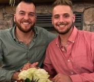 Husbands Reid Alexander and Rafael Díaz pose for a photo and hold hands