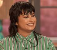 Demi Lovato in a green striped shirt