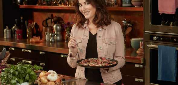 Nigella Lawson holding food in Cook Eat Repeat