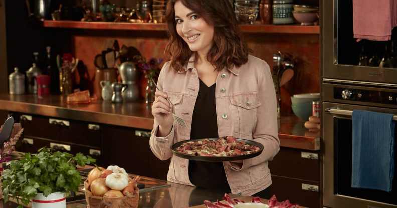 Nigella Lawson holding food in Cook Eat Repeat