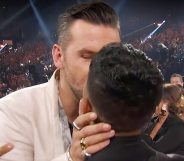 TJ Osborne (L) kisses his boyfriend