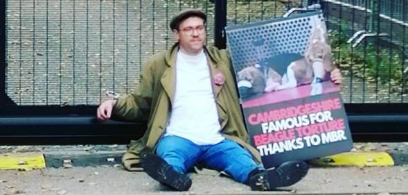 Will Young handcuffed to the gates of a puppy farm