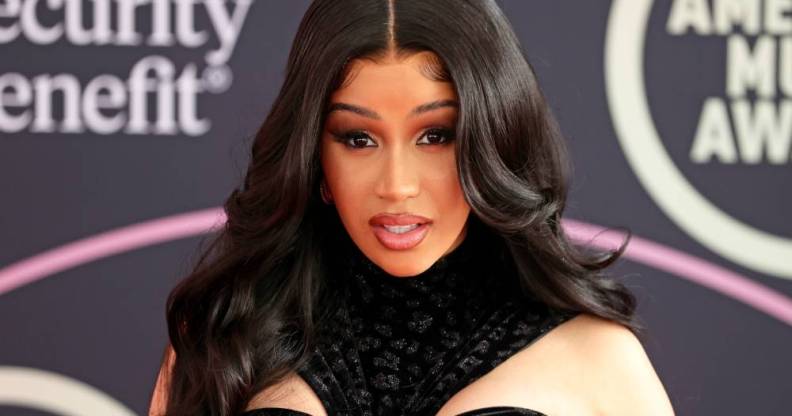 Cardi B posing on the red carpet at the American Music Awards 2021