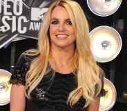 Britney Spears attends the MTV Video Music Awards in 2011 in a black sparkly outfit