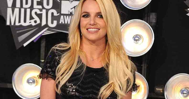 Britney Spears attends the MTV Video Music Awards in 2011 in a black sparkly outfit