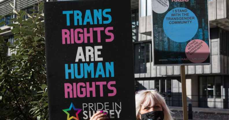 A Pride In Surrey activist protests outside the first annual conference of the LGB Alliance in London