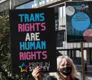 A Pride In Surrey activist protests outside the first annual conference of the LGB Alliance in London