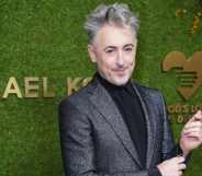 Red carpet headshot of Alan Cumming