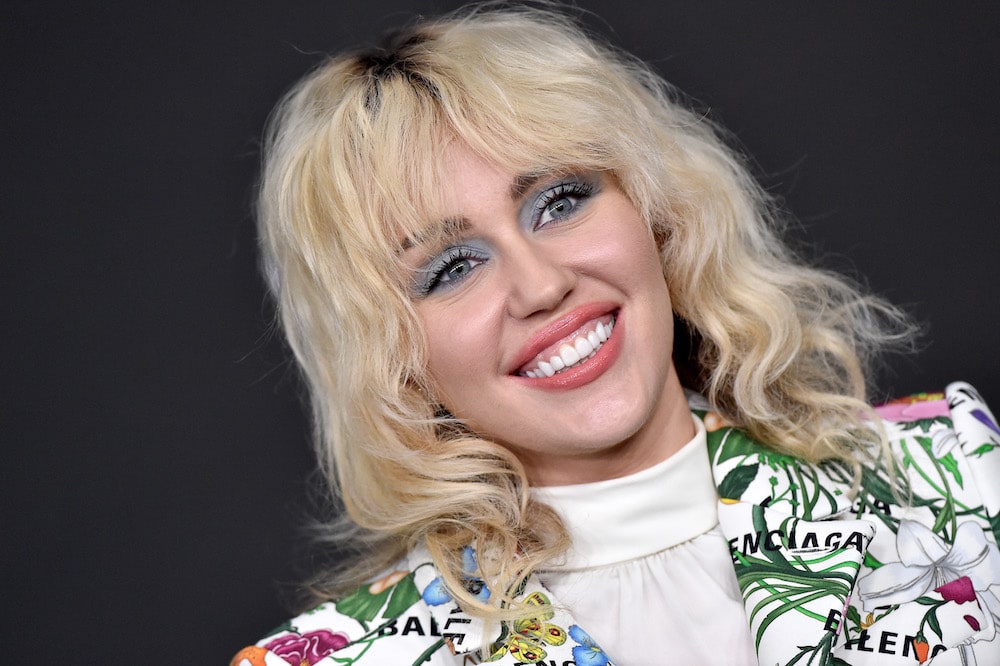 Celebrity vegan Miley Cyrus smiling 