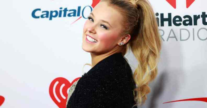 JoJo Siwa smiles as she attends iHeartRadio 102.7 KIIS FM's Jingle Ball 2021
