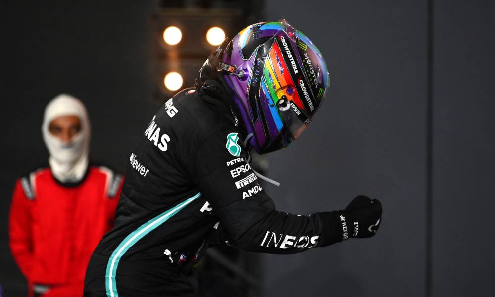 Photo of Lewis Hamilton wearing a Pride helmet as he celebrates his win at the F1 Grand Prix of Saudi Arabia