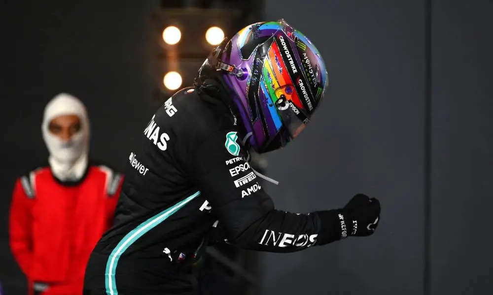Photo of Lewis Hamilton wearing a Pride helmet as he celebrates his win at the F1 Grand Prix of Saudi Arabia