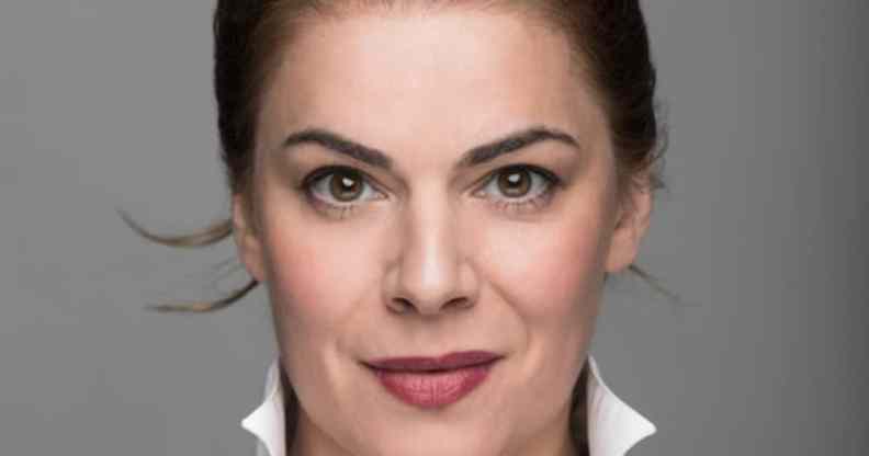 Headshot of Rosie Kay against a grey background