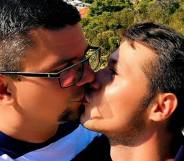 Domagoj Hajdukovic and Matija Stainer share an adorable kiss in front of a beautiful seaside view
