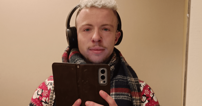 Charlie Middleton, a young trans man, taking a mirror selfie