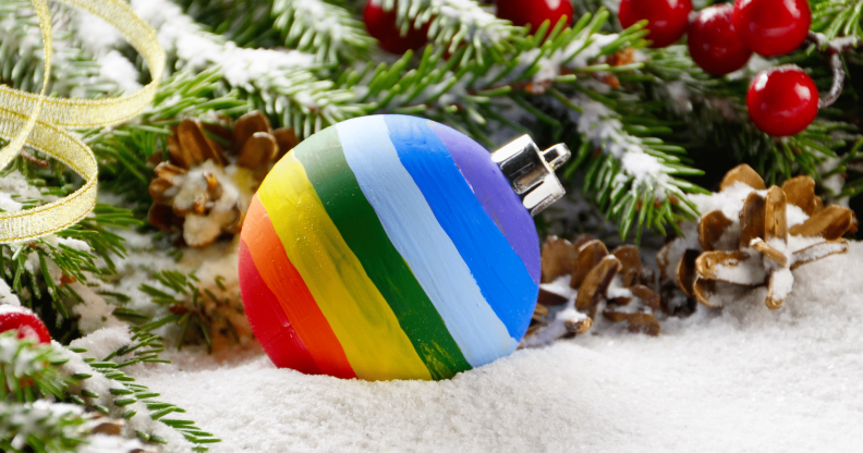 A rainbow bauble on a bed of snow