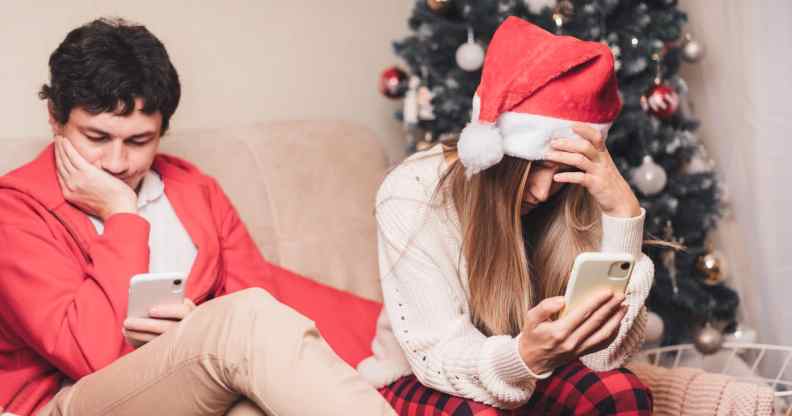 Two people looking miserable at Christmas