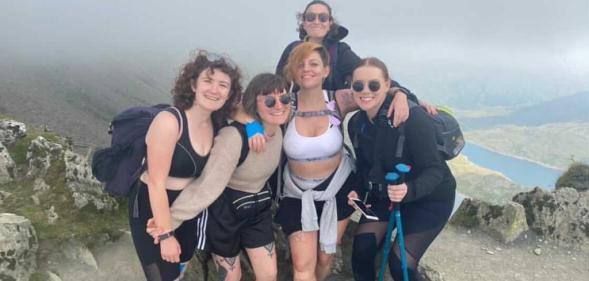 Members of We Are Queer London at the top of Mount Snowden.