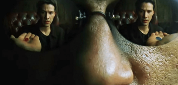 Morpheus wearing reflective sunglasses. In them, you can see Neo reaching for the Red Pill