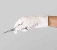 Gloved hand holding scalpel