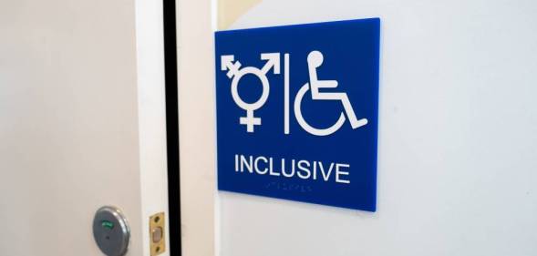 Sign for inclusive bathroom, with symbol indicating male, female and trans as well as handicapped symbol