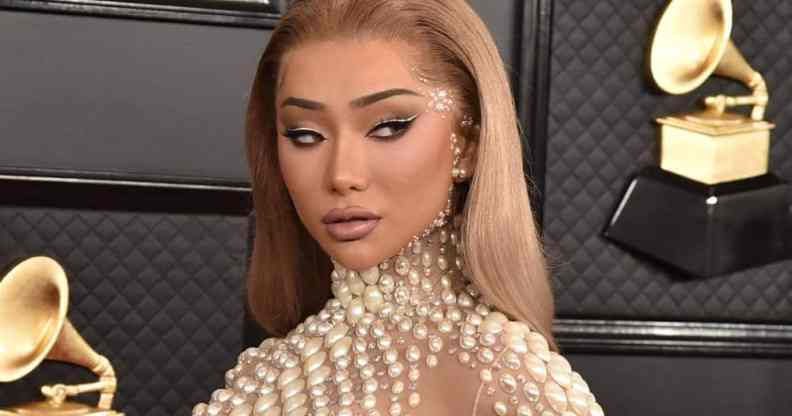 Nikita Dragun is seen in a nude dress with pear-like accents at the Grammy Awards in 2020