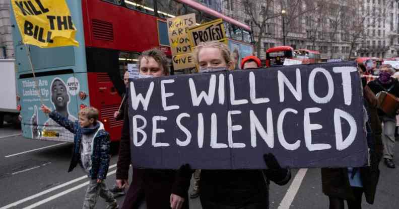 Protestors hold up a sign reading 'we will not be silenced' at demonstration against the Conservative plans for the new Policing Bill in the UK