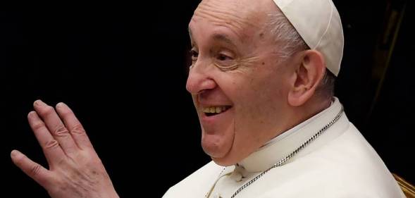 Pope Francis gestures as he meets with attendees during the weekly general audience