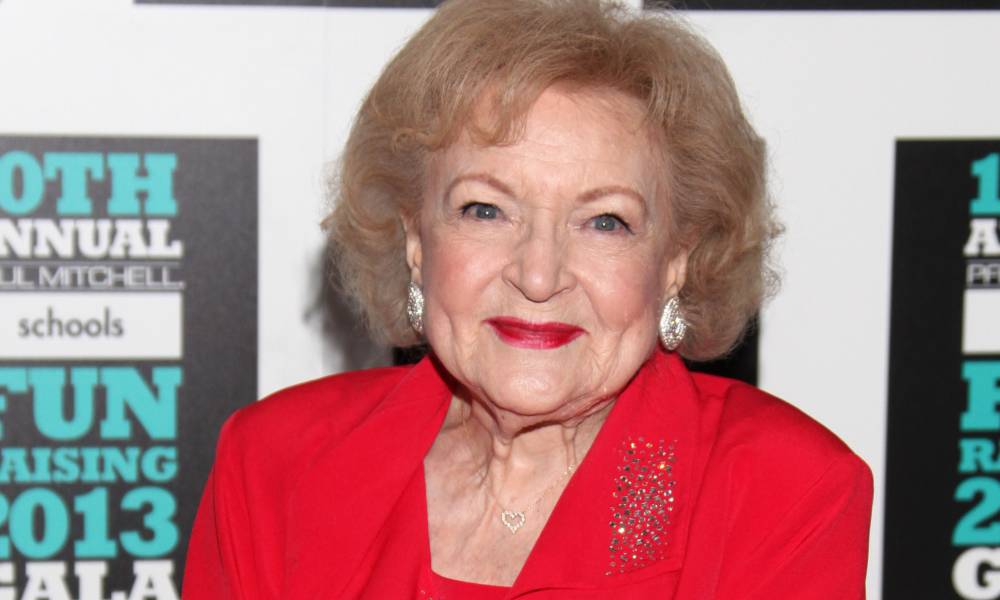 Betty White seen dressed in all red with red lipstick