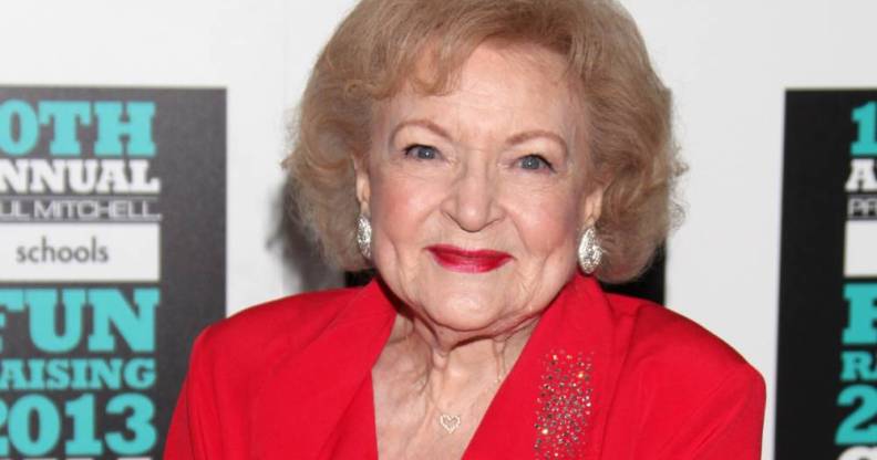 Betty White seen dressed in all red with red lipstick