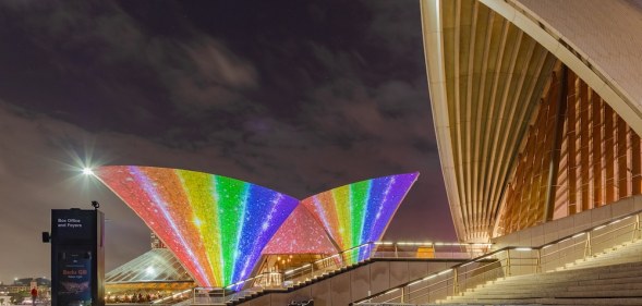 The Sydney Opera House is lit up in rainbow colours