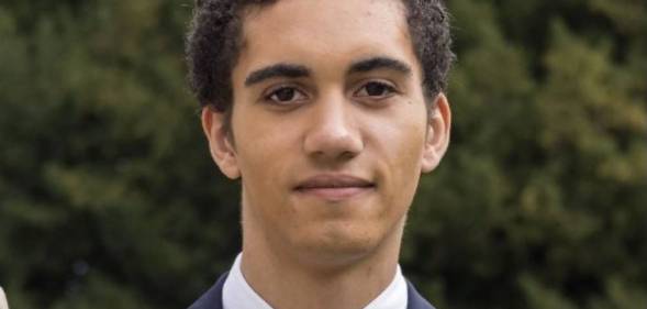 A picture of Harvey Parker in a nice suit and tie