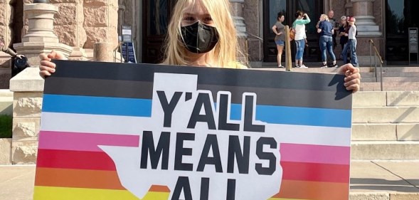 Kai Shappley holding a sign