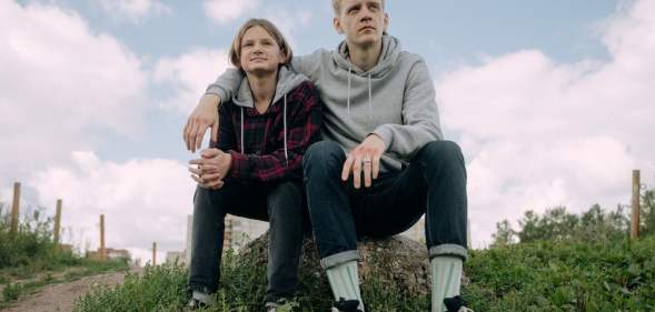 brothers sit on a rock - fraternal birth order effect