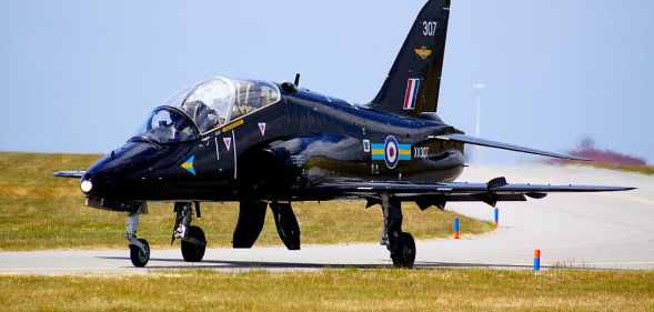 An RAF Hawk jet taxiing on a runway