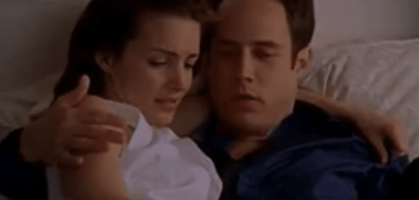 Charlotte looking down a man's trousers