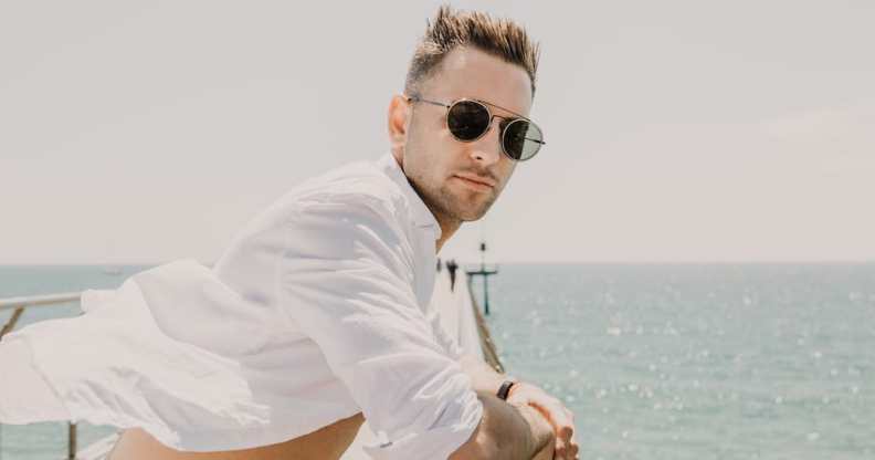 A man stands on the deck of cruise ship