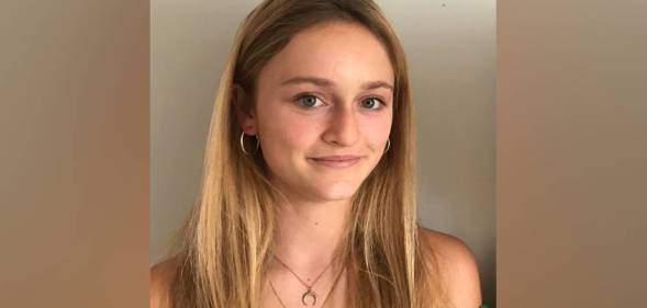 Gemma Tutton smiles at the camera while wearing a green top