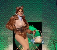 Jimbo, a drag queen, painted as a dog with furry dog ears