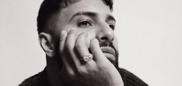 Zaher Saleh rests his chin on his hand