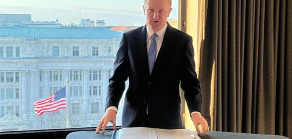 Oliver Dowden uses an ironing board to prepare for his speech to The Heritage Foundation