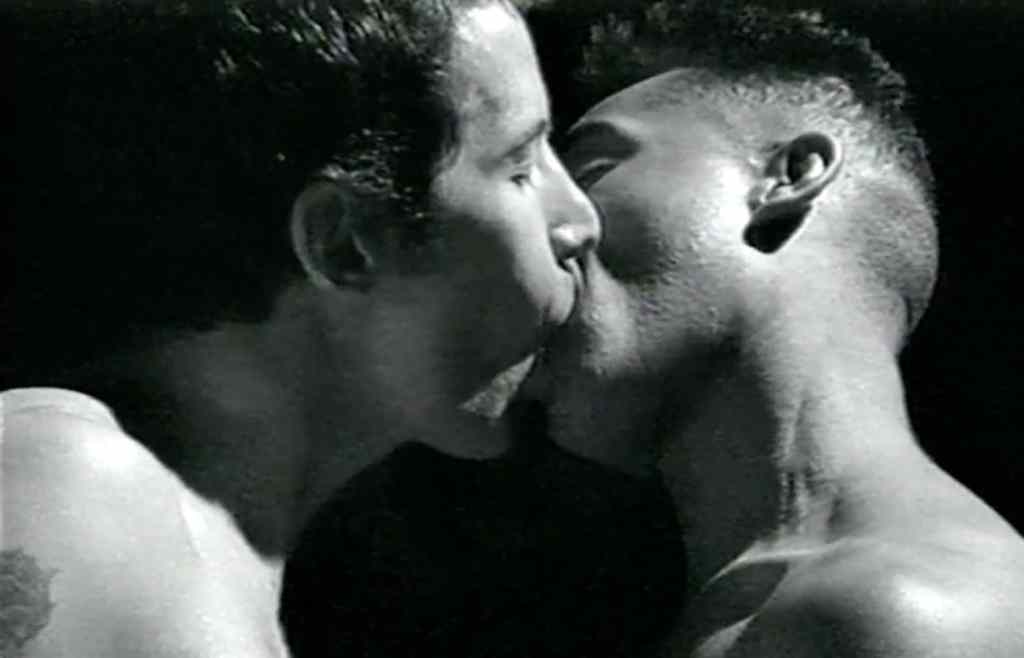 Two men kissing in a still from The Gay Men's Guide to Safer Sex. (Barbican)