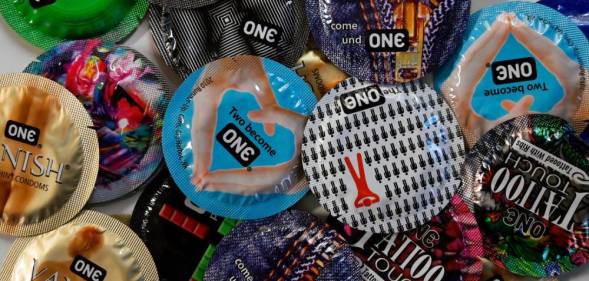 This illustration photo shows "One" condoms displayed on a table