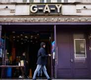 A person walks past the G-A-Y gay bar venue in London, England.