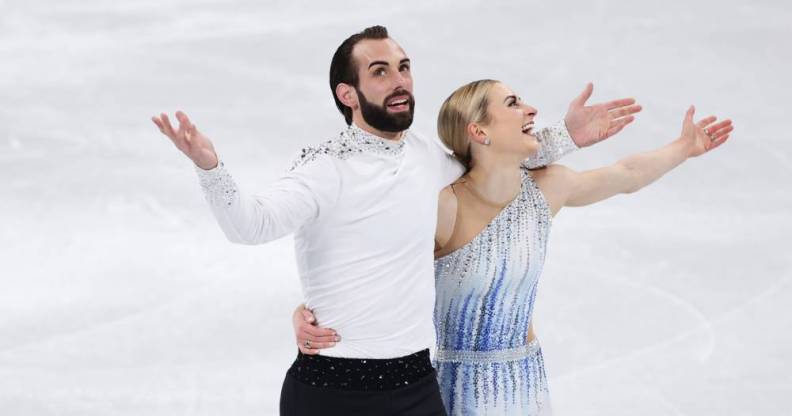 Team USA's Timothy LeDuc and Ashley Cain-Gribble react after skating during the Pair Skating Short Program at the 2022 Beijing Olympics