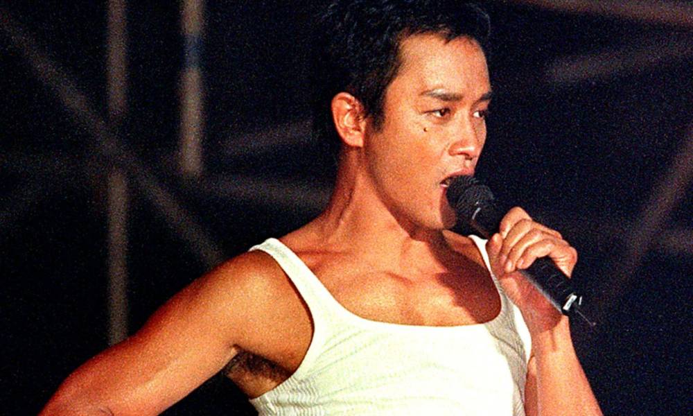 Leslie Cheung, a singer, poses on stage during a concert
