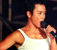 Leslie Cheung, a singer, poses on stage during a concert