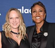 Good Morning America host Robin Roberts stands next to her partner Amber Laign