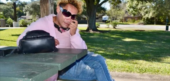 Martina Caldera sits on a park bench